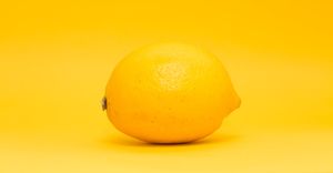 Lemon on lemon-colored surface