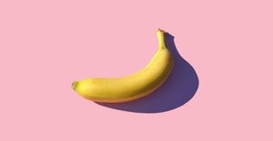Banana on pink surface